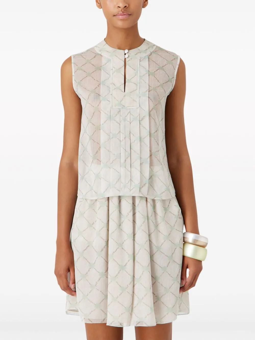 Blusa smanicata con stampa